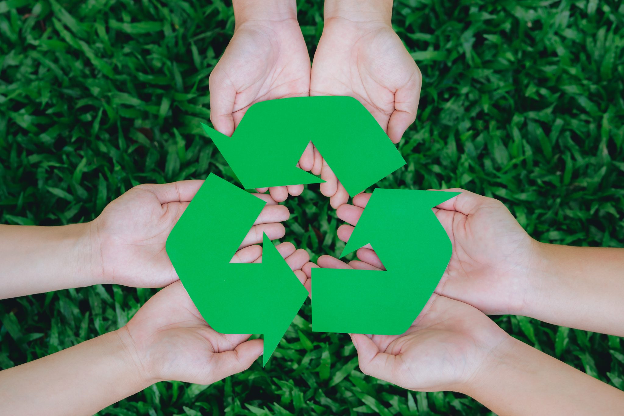 Hand holding recycle symbol together.Concept for ecological wast